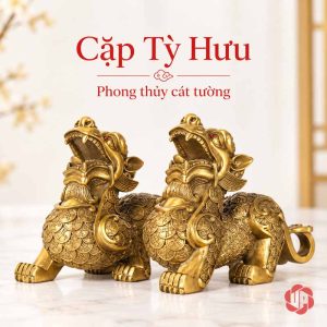 Hai tượng tỳ hưu vàng đồng trên nền sáng với phần đầu quay về phía trước