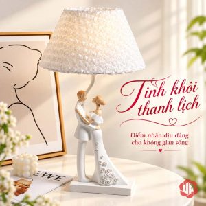Đèn chao trắng với tượng cô dâu chú rể ôm nhau trên bàn sáng