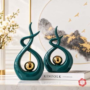 Đồ trang trí decor cặp tượng xanh ngọc ôm cầu vàng bên sách