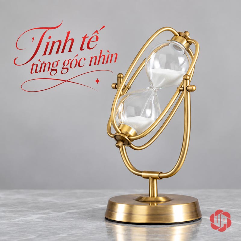 Đồng Hồ Cát Trang Trí Khung Oval Vàng UPV007-A Góc nghiêng đồng hồ cát oval trên mặt bàn xám