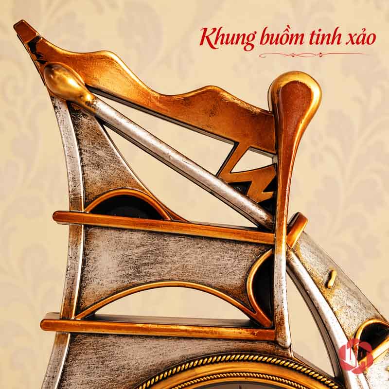 Đồng Hồ Đặt Bàn Thuyền Buồm, Thuận Buồm Xuôi Gió UPHB16 Cận đỉnh buồm và các đường khung ánh vàng trên mẫu tông nâu