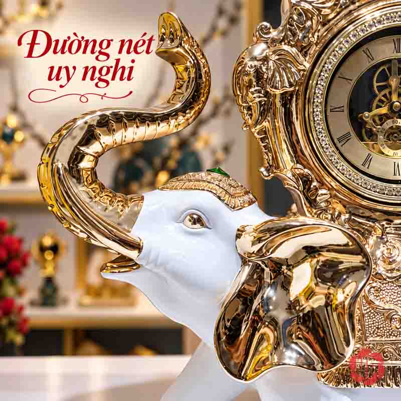 Đồng Hồ Trang Trí Voi Phong Thủy Trắng Vàng UPHB23 Cận đầu voi trắng với vòi cong vươn lên và tai ánh vàng