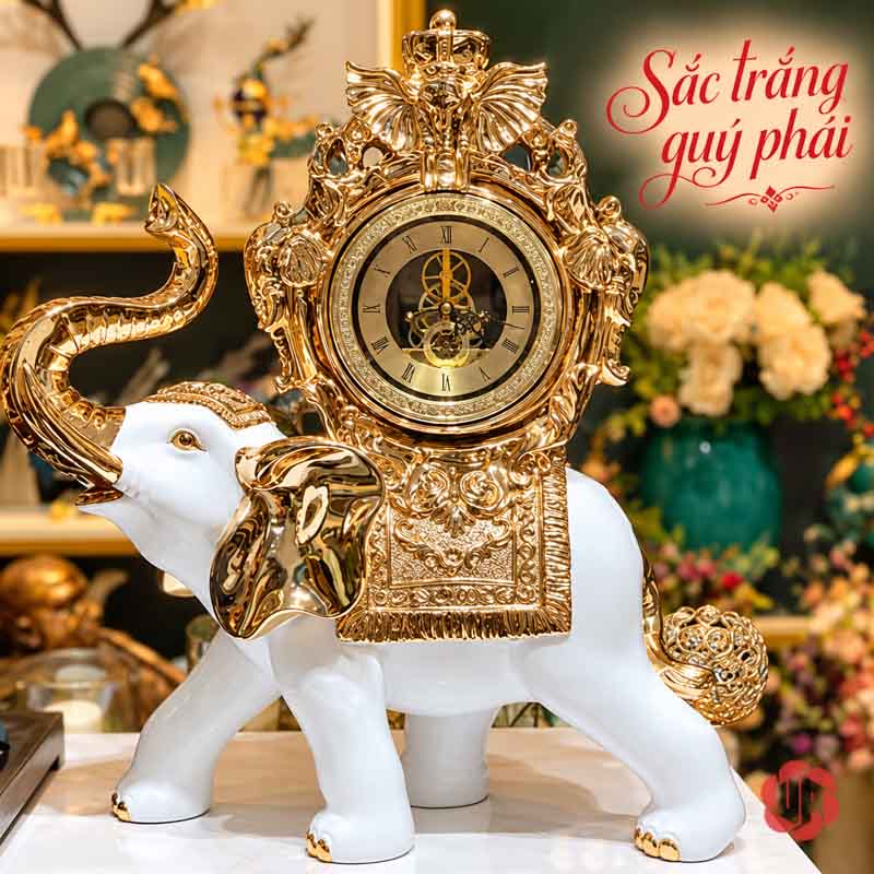 Đồng Hồ Trang Trí Voi Phong Thủy Trắng Vàng UPHB23 Đồng hồ voi trắng với khung mặt số nhiều lớp ánh vàng
