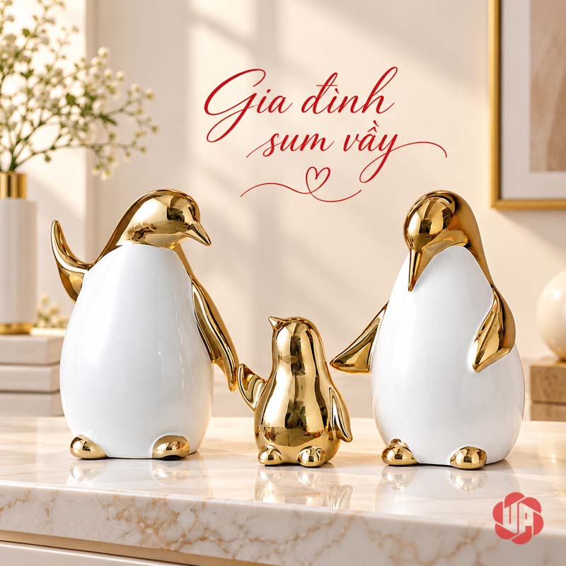 Tượng Decor Gia Đình Chim Cánh Cụt Trắng Vàng UPV080 Gia đình ba chim cánh cụt trắng vàng trên mặt bàn sáng