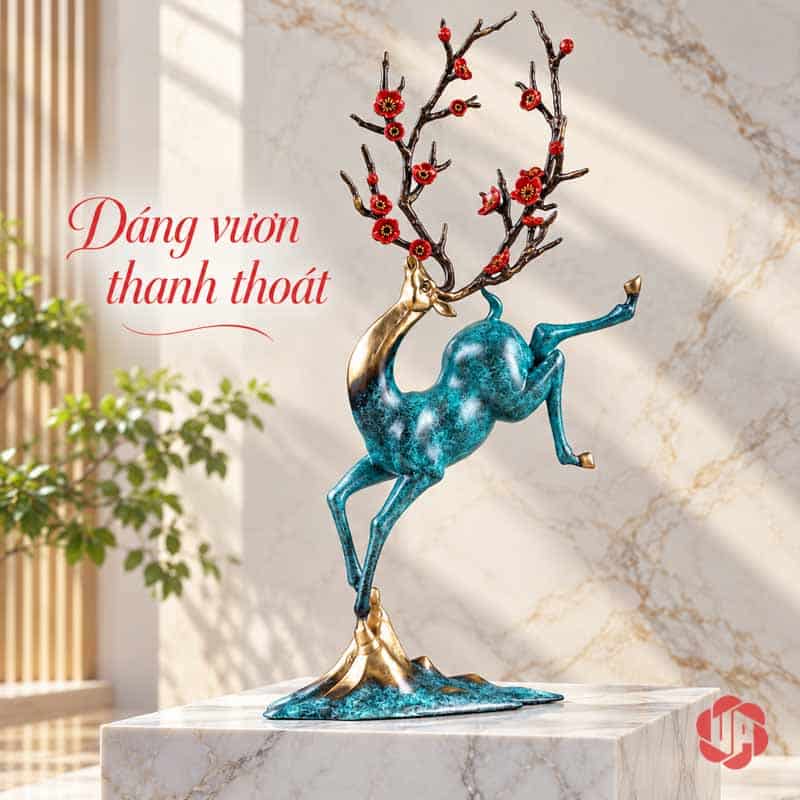 Tượng Hươu Nghệ Thuật Bằng Đồng, Dáng Vươn Hoa Đỏ UPD071 Tượng hươu dáng vươn đặt trên bệ đá sáng trước tường vân nhẹ