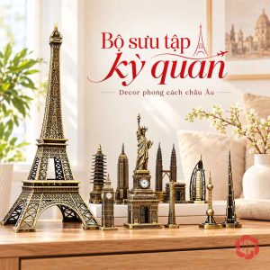 Tháp Eiffel lớn cạnh nhóm mô hình kiến trúc trên bàn gỗ