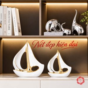 Tượng decor cánh buồm xuôi gió phối đôi trên kệ gỗ dưới tượng voi