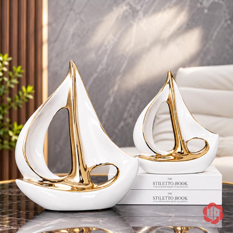 Tượng Decor Cánh Buồm Xuôi Gió Gốm Sứ Trắng Vàng UP053-A Tượng decor cánh buồm xuôi gió trắng vàng phối hai cỡ bên sách