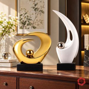 Tượng trang trí Đôi Mắt màu vàng phối tượng trắng dáng cao trên tủ gỗ