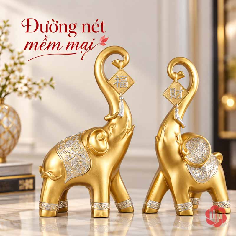 Đồ Decor Cặp Voi Phú Quý Trang Trí Phòng Khách UPV017 Hai tượng voi vàng nhìn nghiêng với dáng vòi cong và họa tiết trên lưng