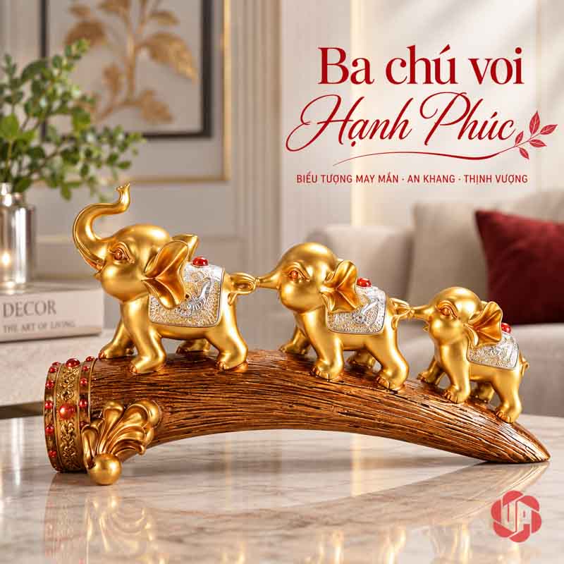 Tượng Gia Đình Voi Hạnh Phúc Trang Trí Nội Thất Phòng Khách UPV022 Cụm tượng ba voi vàng trên bàn sáng, khăn lưng bạc và điểm trang trí đỏ