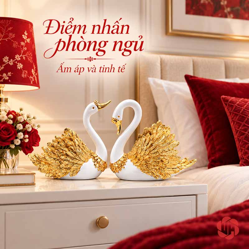 Đôi Tượng Thiên Nga Trắng Cánh Vàng UPV060 Đôi thiên nga trên tab trắng bên giường có gối đỏ