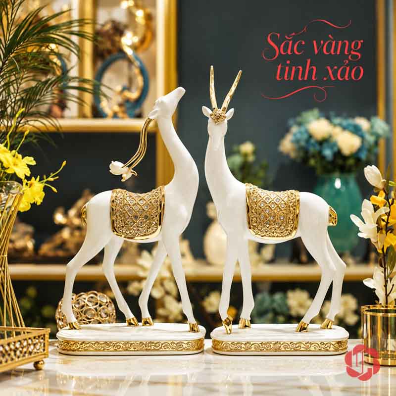 Đôi Tượng Dê Nghệ Thuật Trắng Vàng UPV064 Đôi tượng dê trắng với hoa văn vàng trong góc nội thất